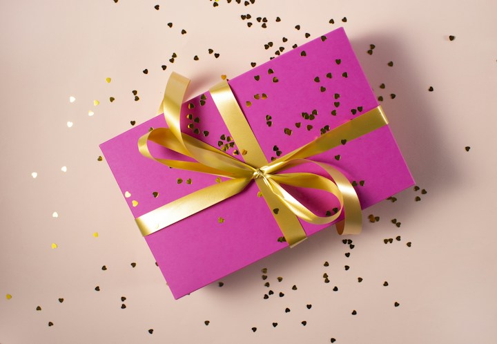 Pink gift box with a gold ribbon